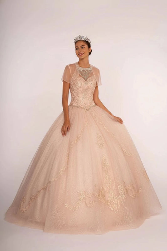 Sweeping Champagne quinceañera ball gown is shown in full with a sheer bolero over a beaded champagne A-line skirt.