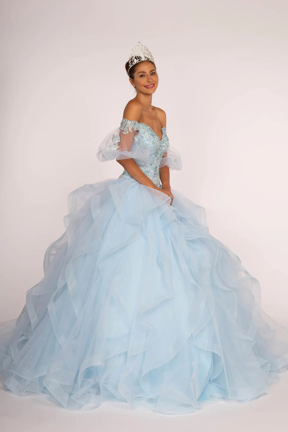 Full-length view presents the Baby Blue quinceañera ball gown with layered tulle skirt.