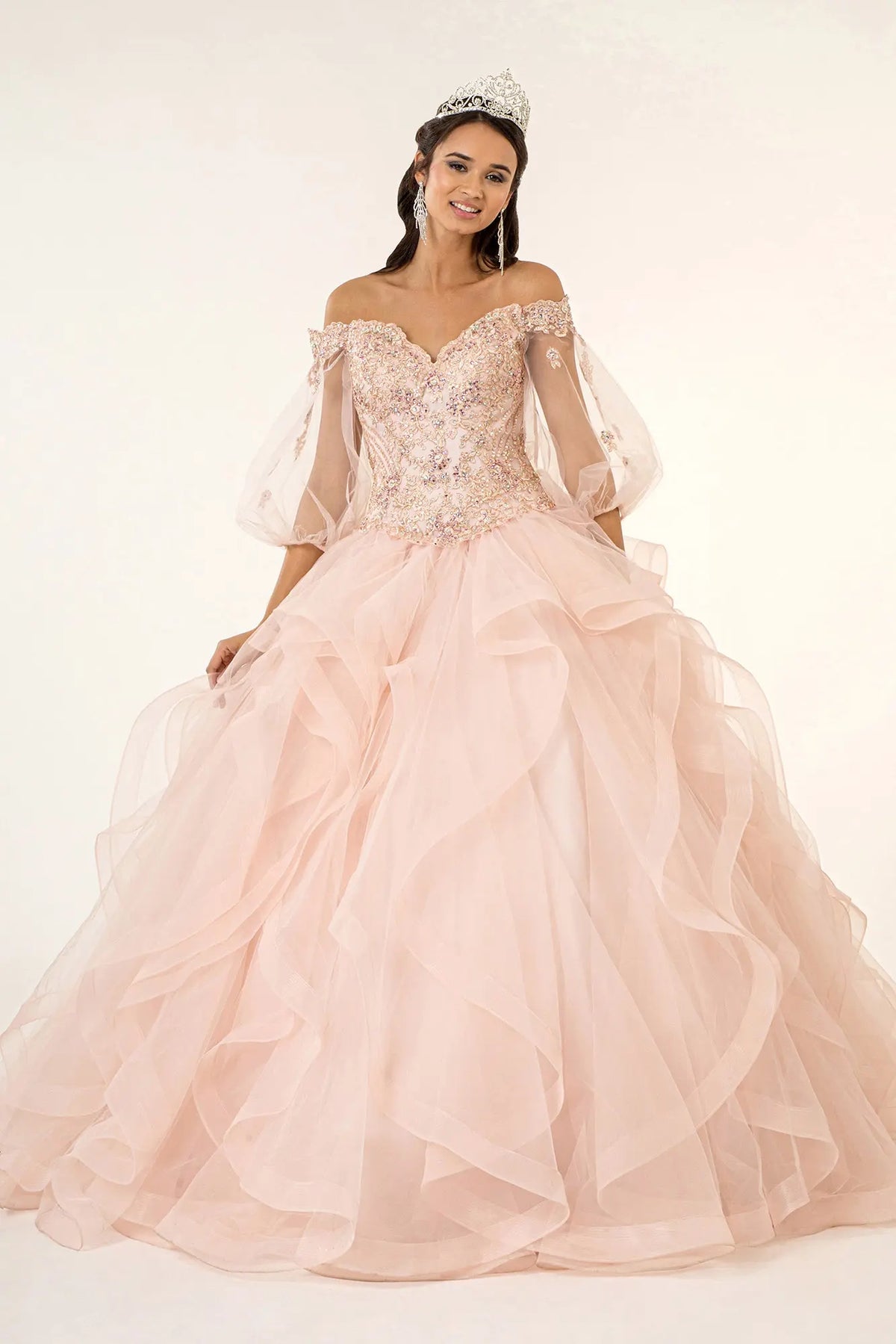 Full-length view presents the Blush quinceañera ball gown with layered tulle skirt.