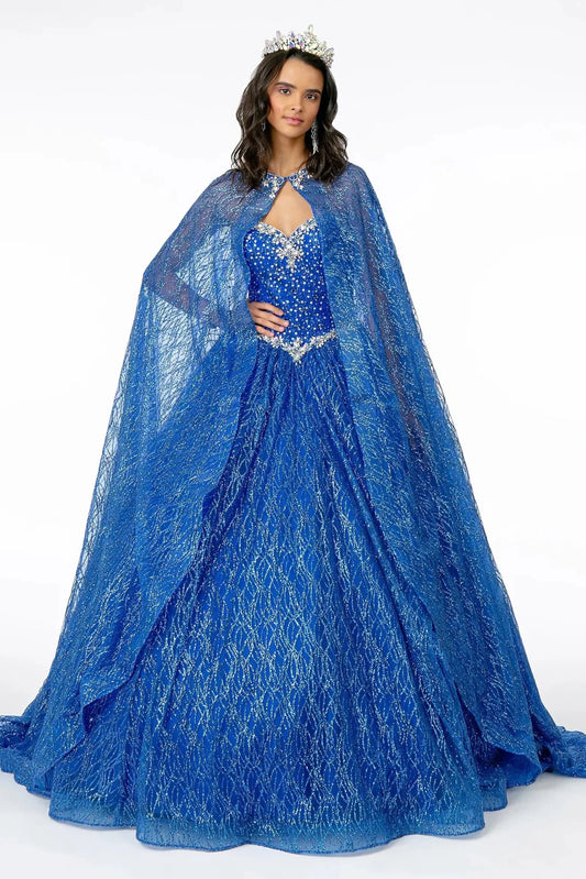 Full-length Royal Blue quinceañera ball gown showcases a sheer lace cape over a sparkling royal-blue ball skirt.