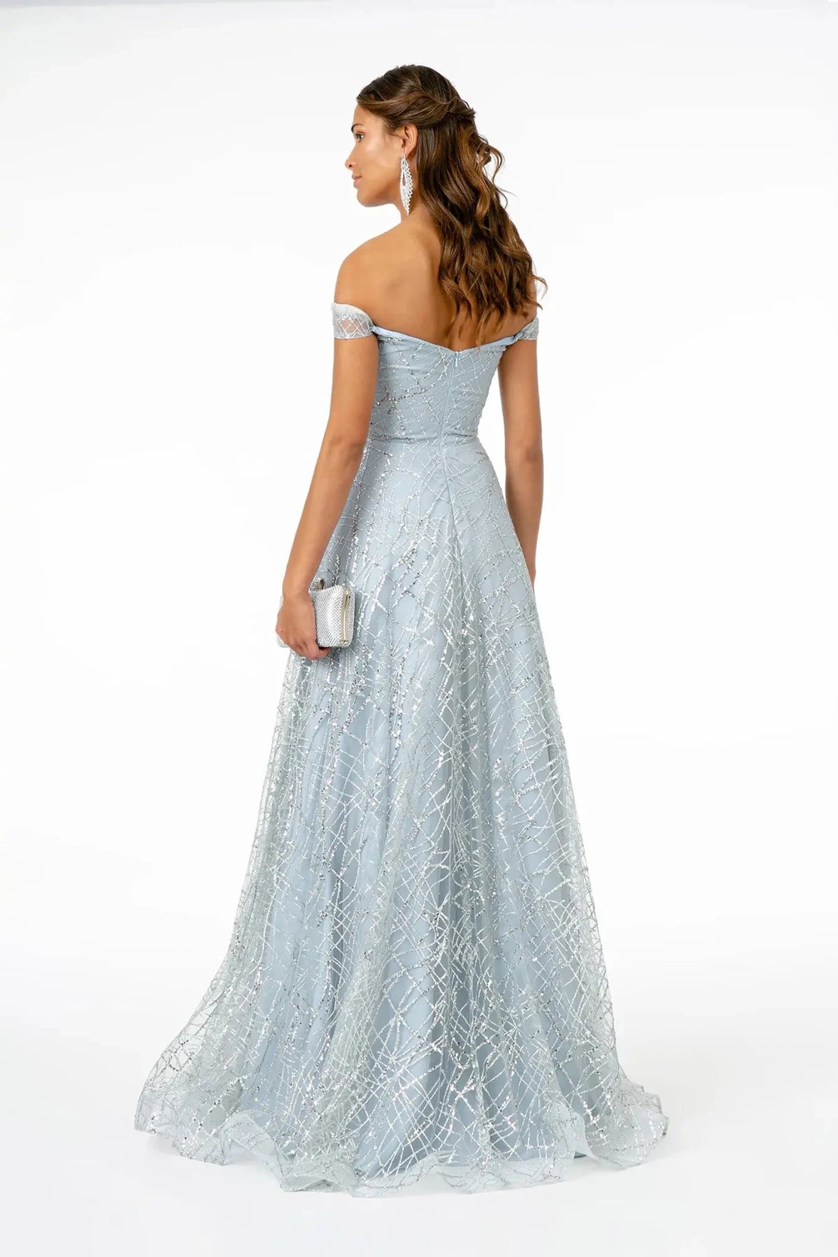 Rear view highlights the back detail of the Silver prom evening dress.