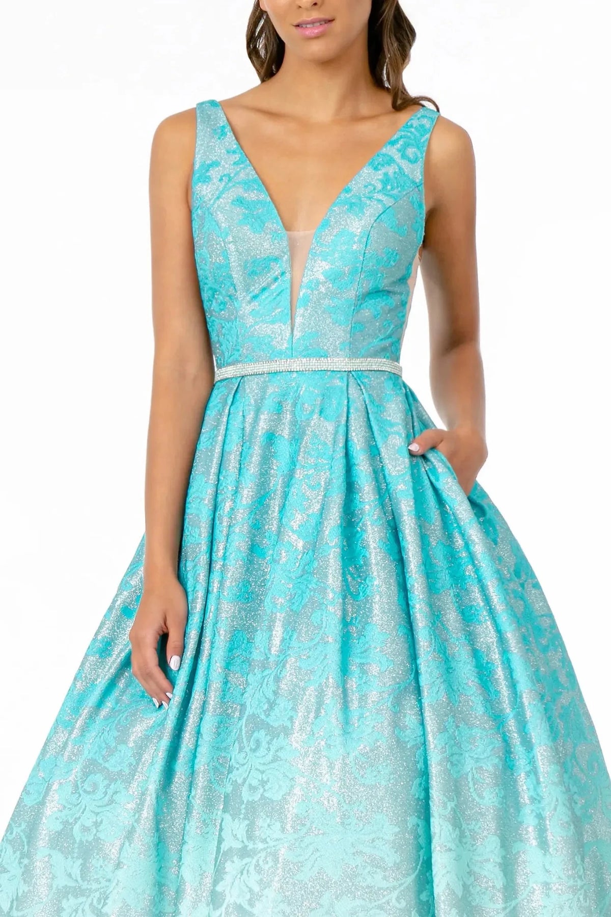 Rear view highlights the open back of the Mint prom evening dress.