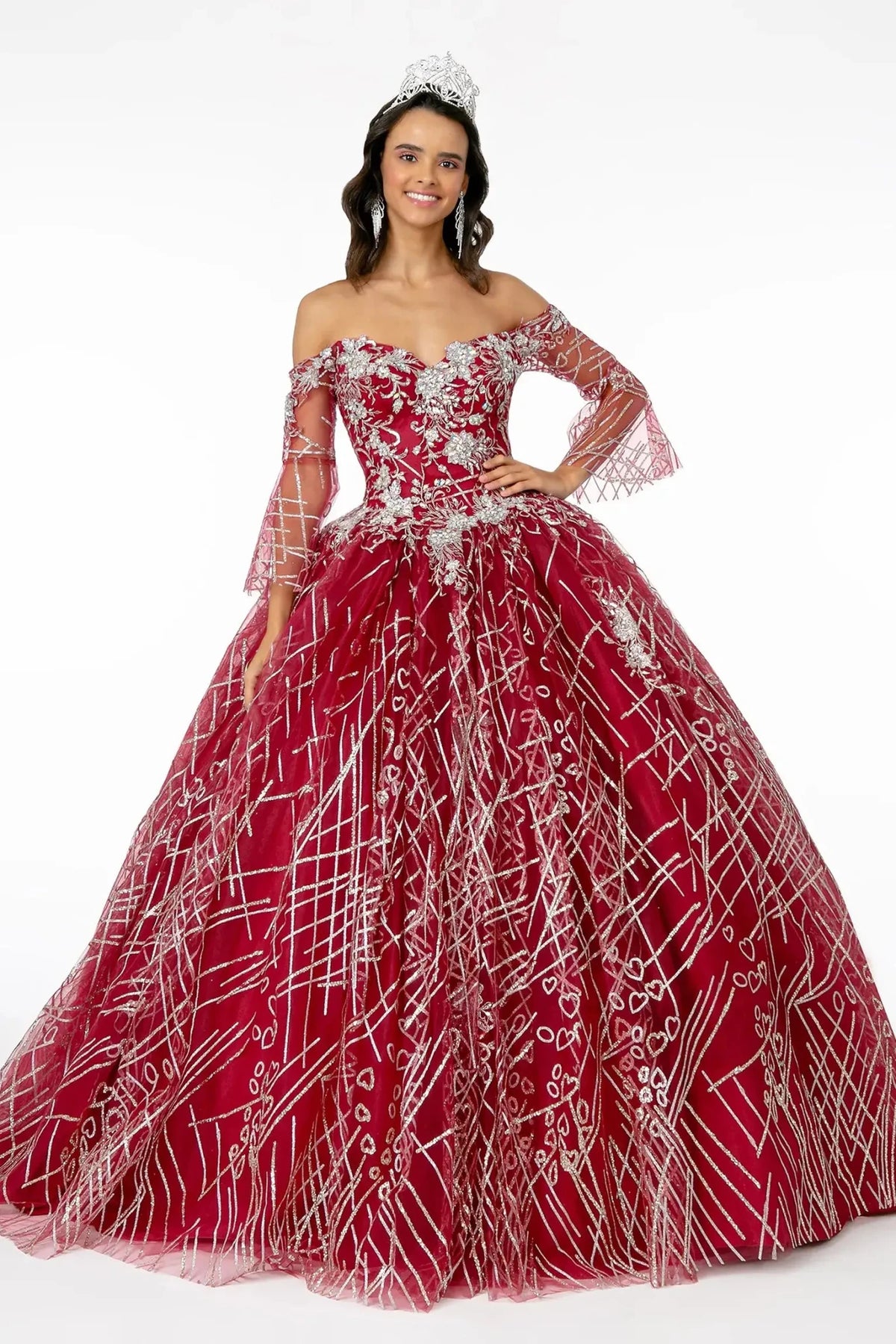 Displayed in full, the Burgundy quinceañera ball gown features sheer bell sleeves and silver embroidery over burgundy tulle.
