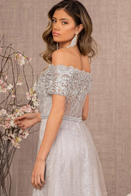 Detailed view highlights silver beading embellished embroidery formal dress detail.