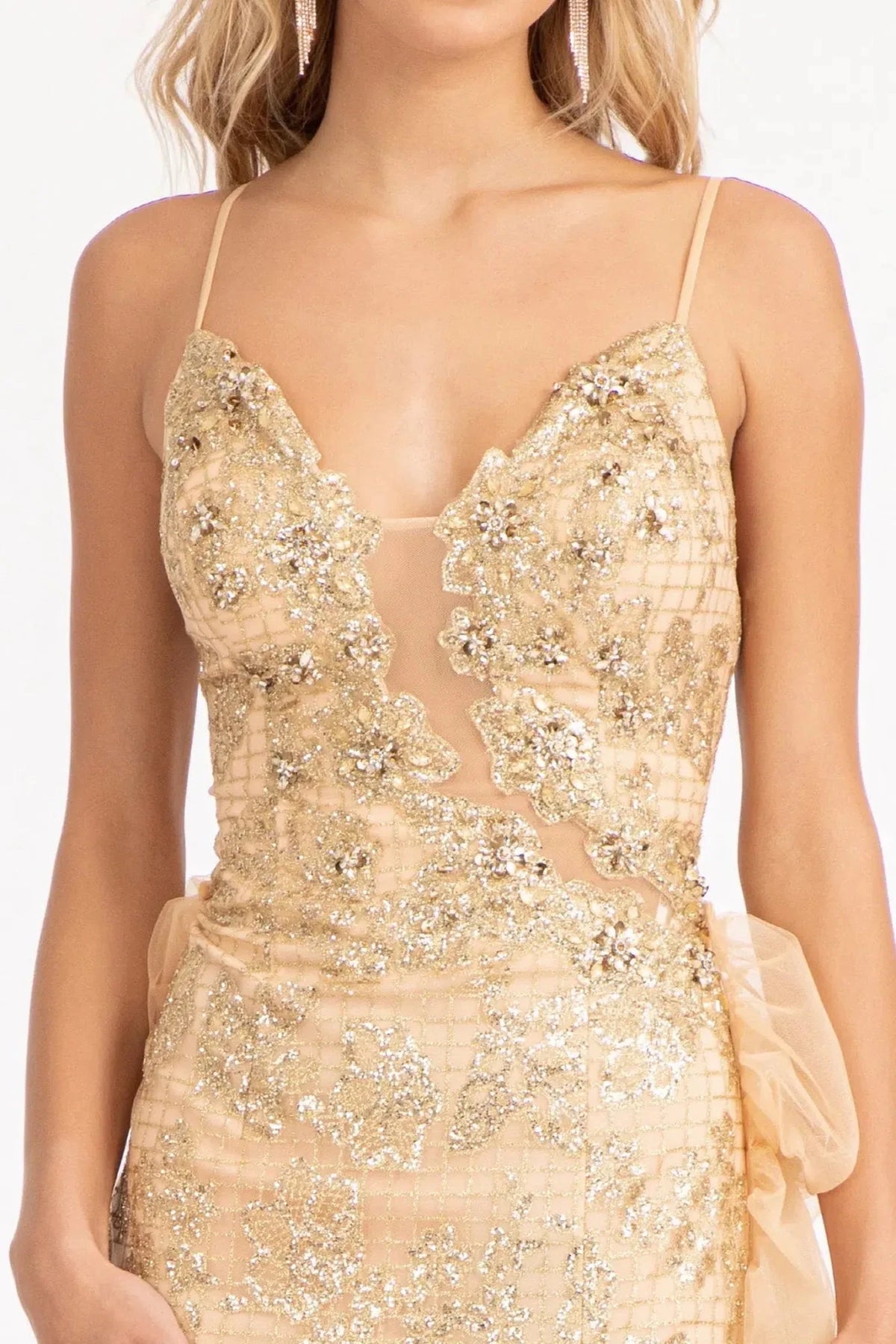 Close-up spaghetti strap detailing defines the bodice of the Champagne prom evening dress.