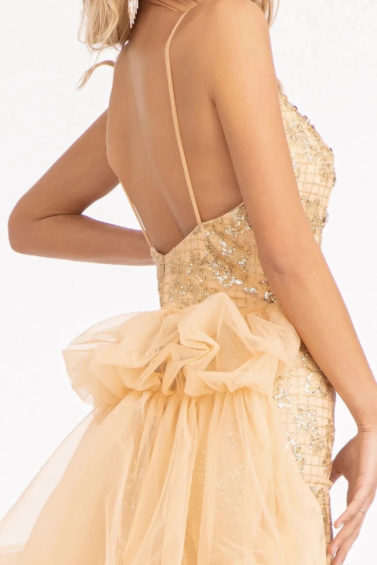 Detailed beadwork, glitter, and jewel accents enriches the Champagne prom evening dress.