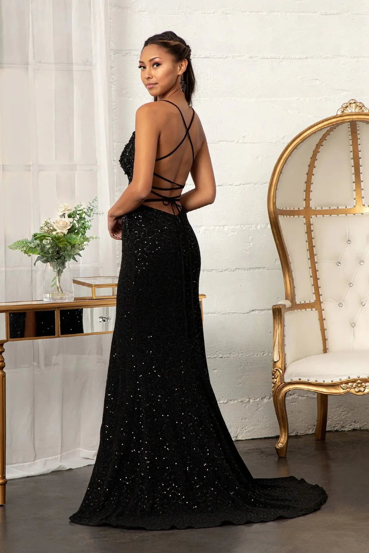 Rear view highlights the lace-up back of the Black prom evening dress.