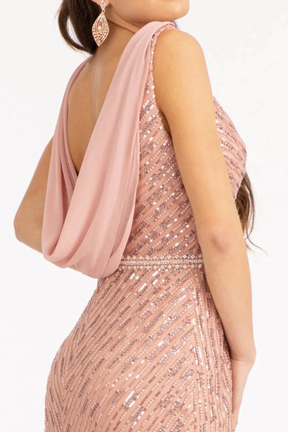 Textured details appear across dusty Rose mother of the bride dress featuring formal gown with scoop-neck, straps, and mesh skirt.
