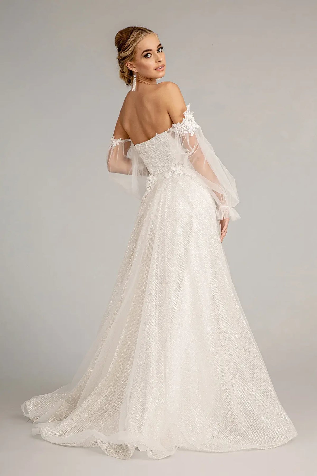 Off White mother of the bride dress with an open back and sheer puff sleeves