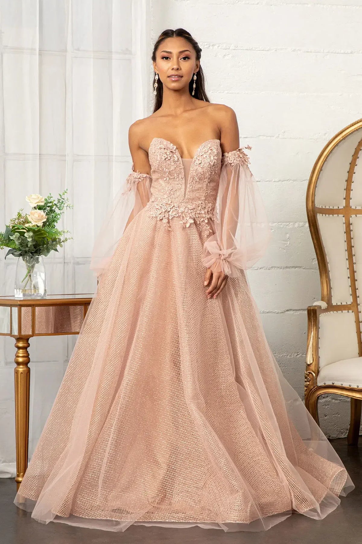 Rose Gold mother of the bride dress with sheer gathered sleeves beside a floral bodice