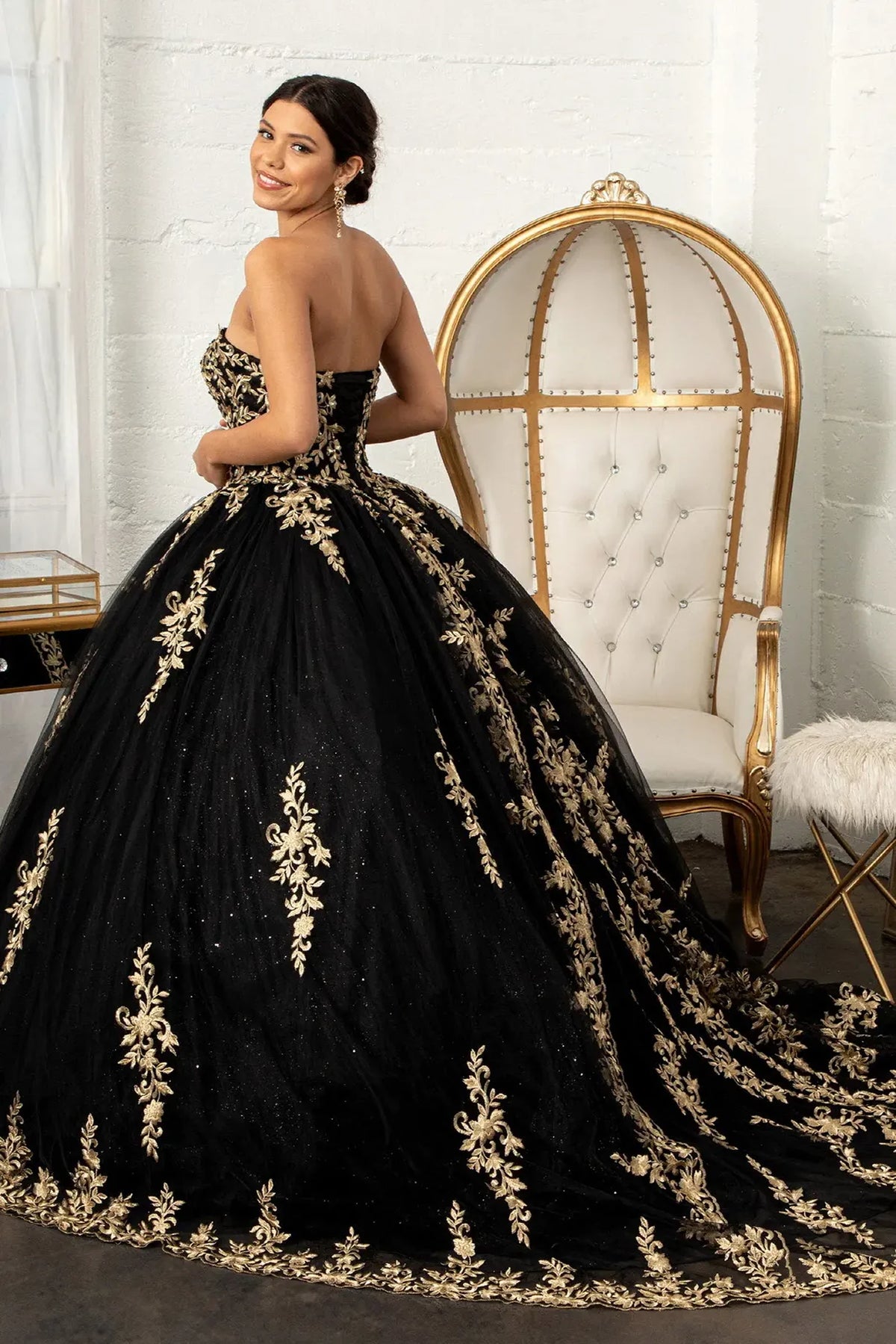 Bodice close-up highlights the Black quinceañera ball gown with metallic embroidery.