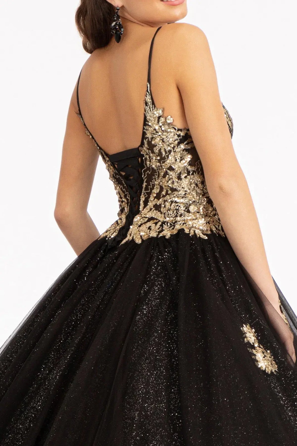 Embroidered details frame the Black quinceañera ball gown with sheer sequin bodice.