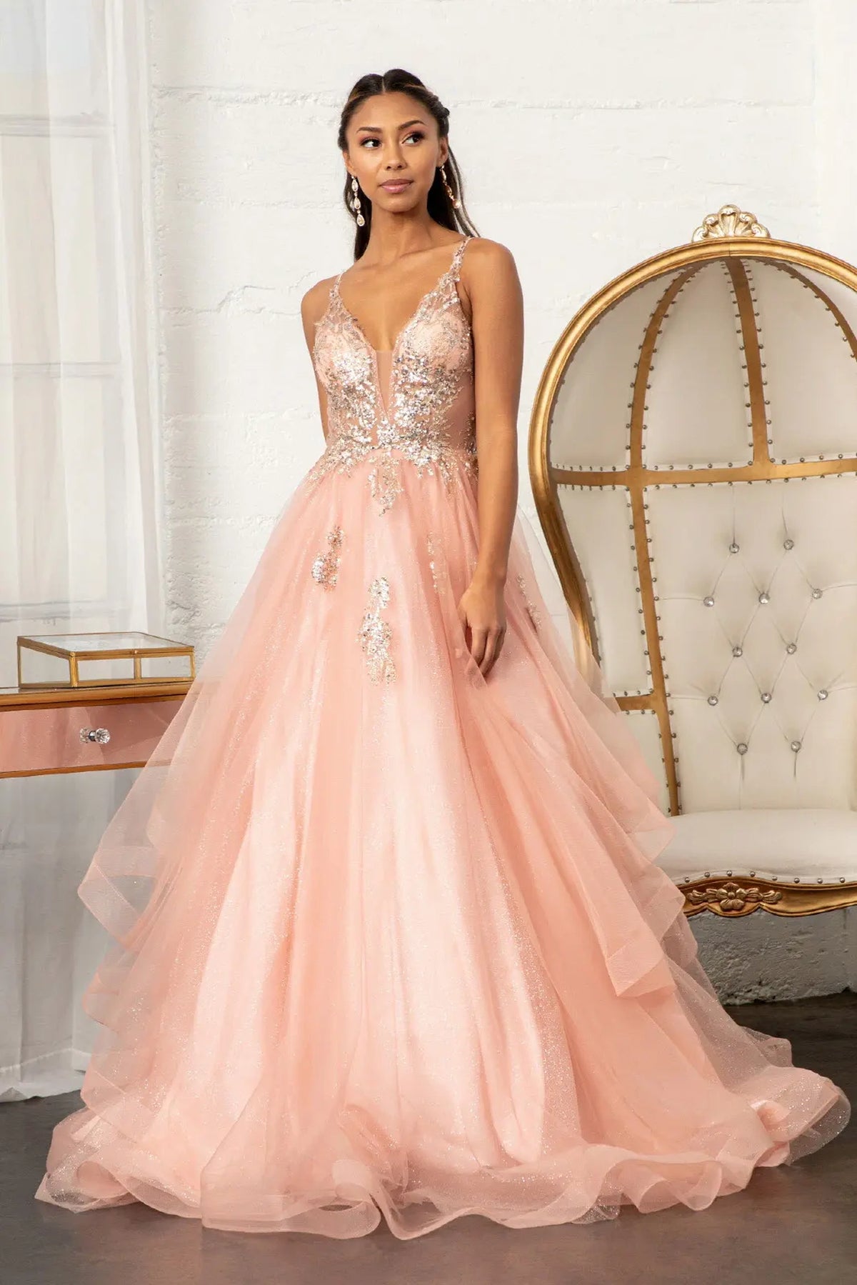 Lace-up back reveals the Rose Gold quinceañera ball gown with lace-up back and glitter mesh skirt.