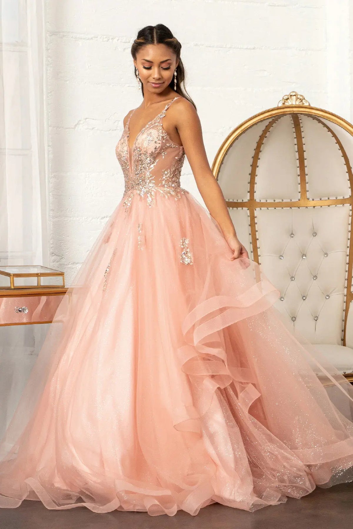 Embroidered details frame the Rose Gold quinceañera ball gown with sheer sequin bodice.