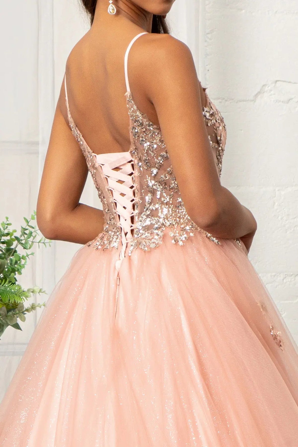 Detachable accents complete the Rose Gold quinceañera ball gown with sheer sequin bodice.