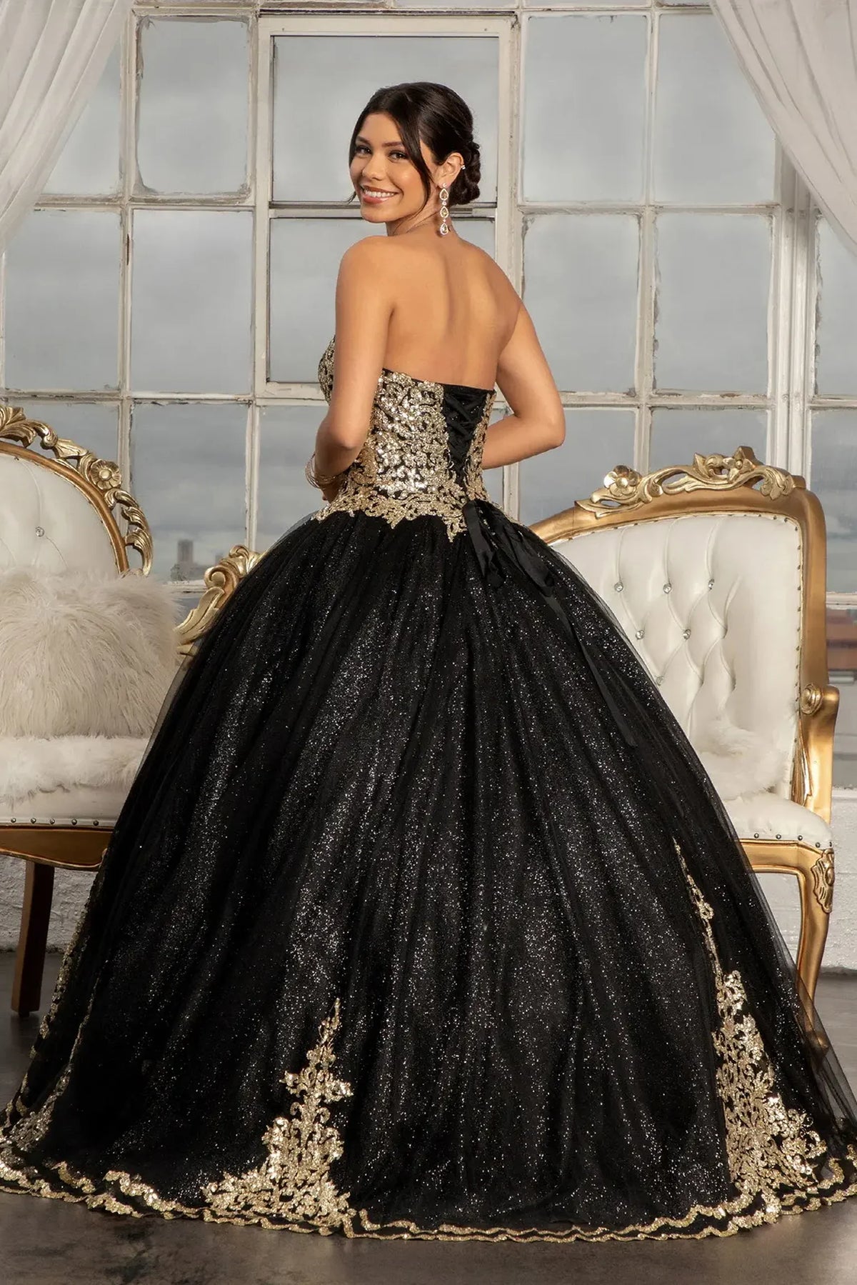 Bodice close-up highlights the Black quinceañera ball gown with glitter mesh skirt.