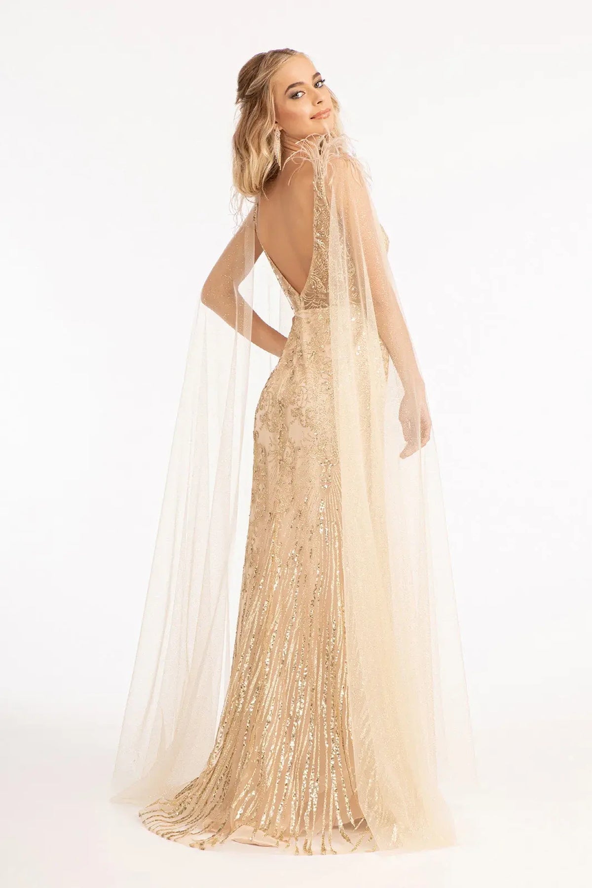 Champagne mother of the bride dress with a deep V-back beneath long drapes