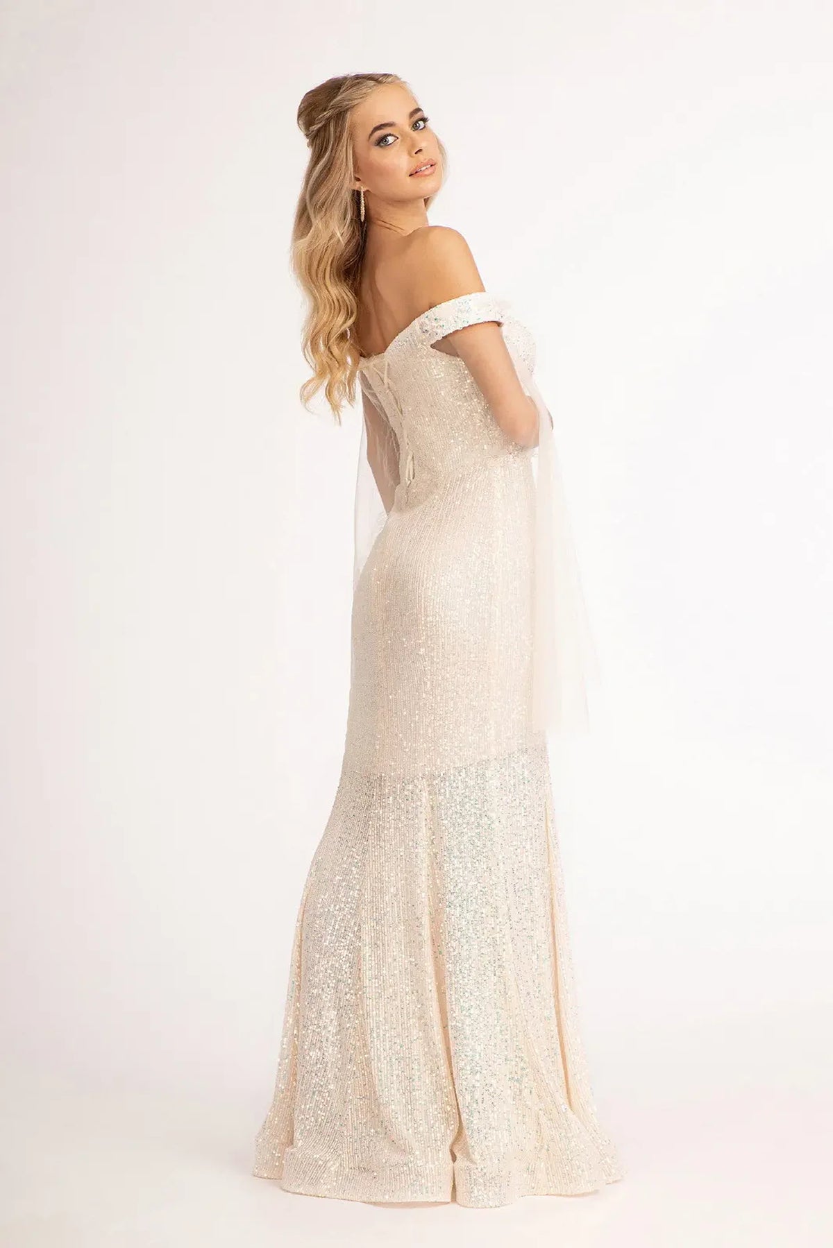 Champagne mother of the bride dress with a lace-up back above a mermaid skirt