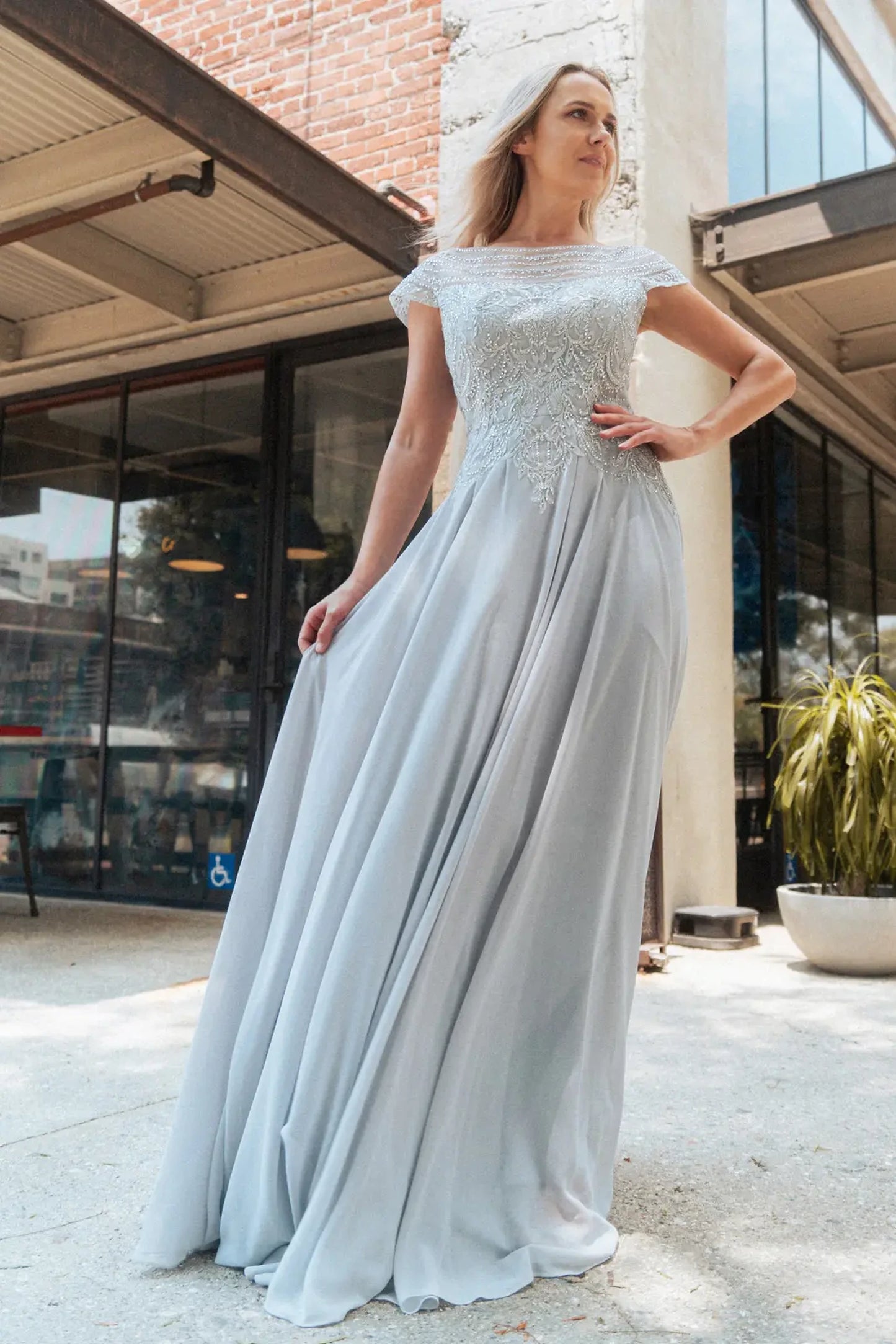 Silver mother of the bride dress featuring chiffon skirt with a-line shaping and beads, embroidery