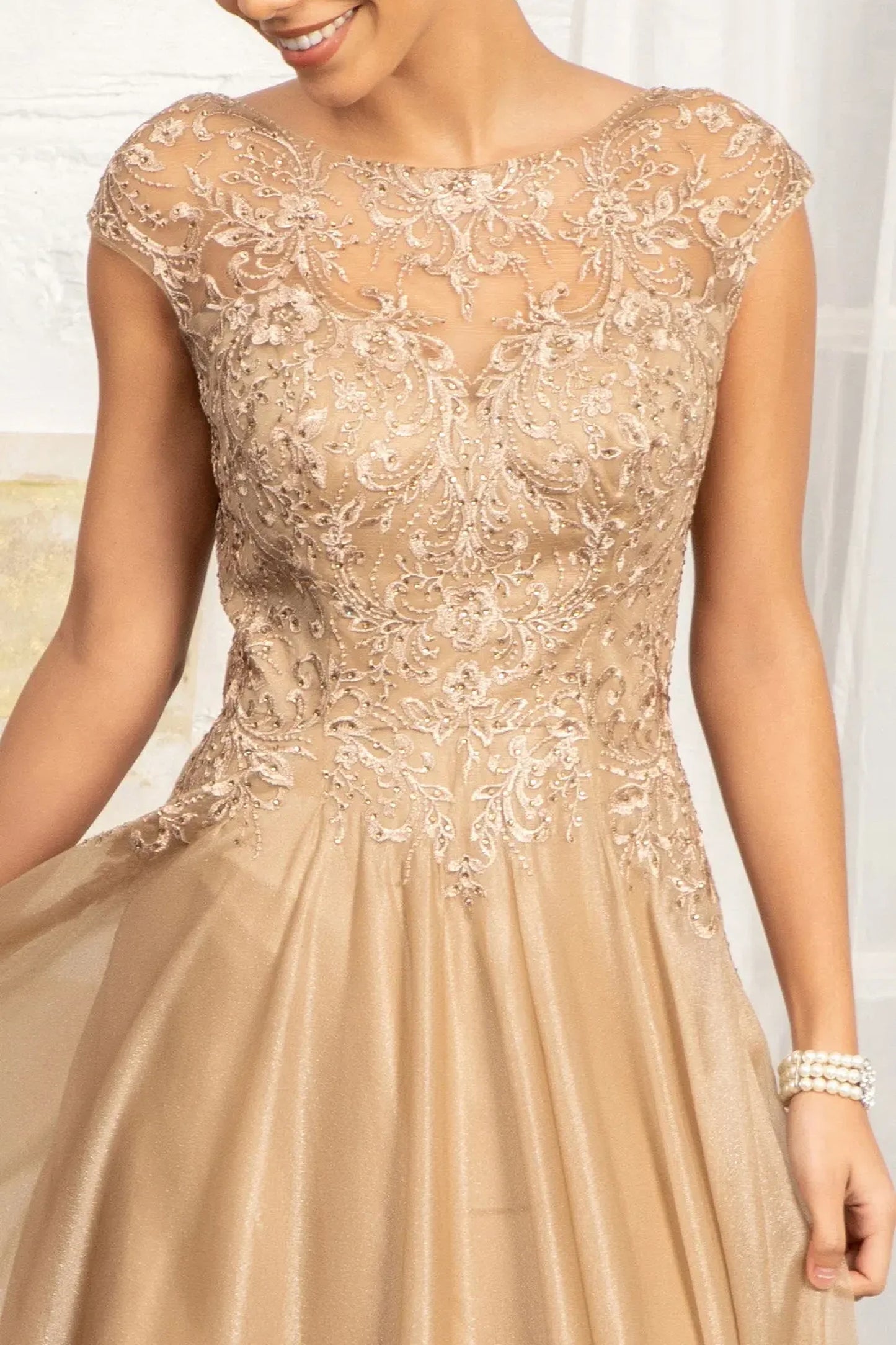 Gold mother of the bride dress featuring boat-neck bodice with cap sleeve and beads, embroidery