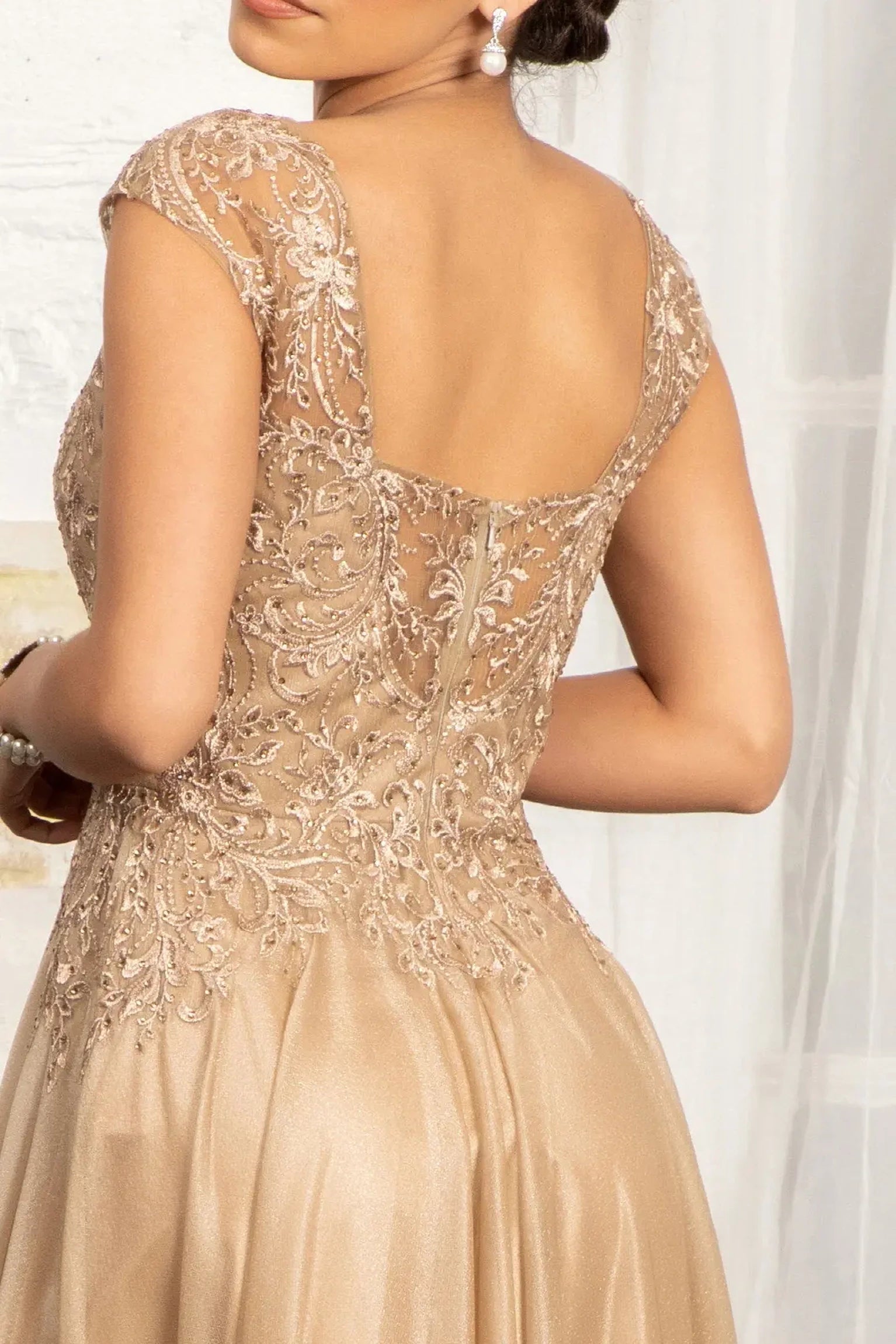 Gold mother of the bride dress featuring concealed zipper back bodice finished with beads, embroidery