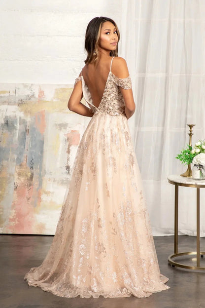 Rear view reveals champagne a-line mother of the bride dress with v-back with concealed zipper and spaghetti strap.