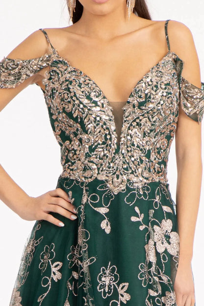 Bodice close-up highlights emerald Green mother of the bride dress featuring illusion v-neck bodice with spaghetti strap and beads.