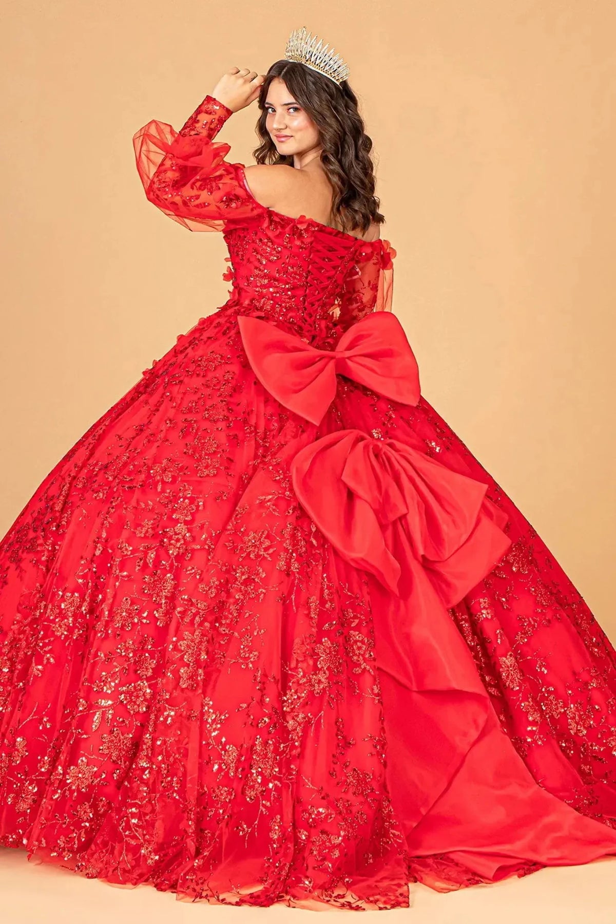 Bodice close-up highlights the Red quinceañera ball gown with long puff sleeves.