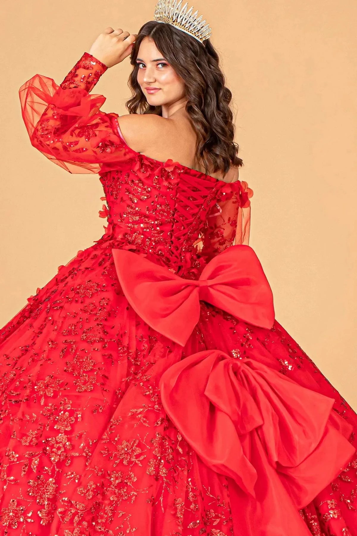 Embroidered details frame the Red quinceañera ball gown with detachable back bow.
