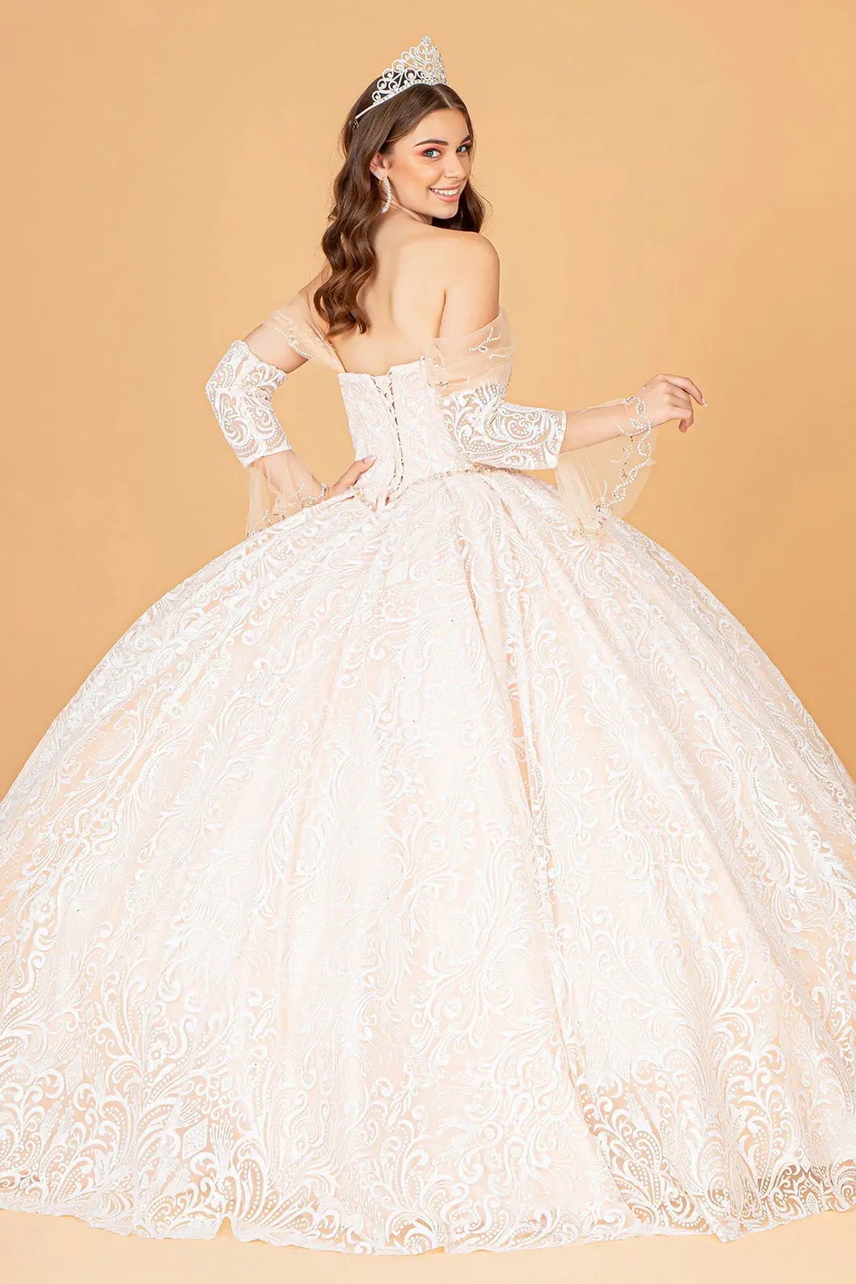 Bodice close-up highlights the Champagne quinceañera ball gown with matching mini bag.