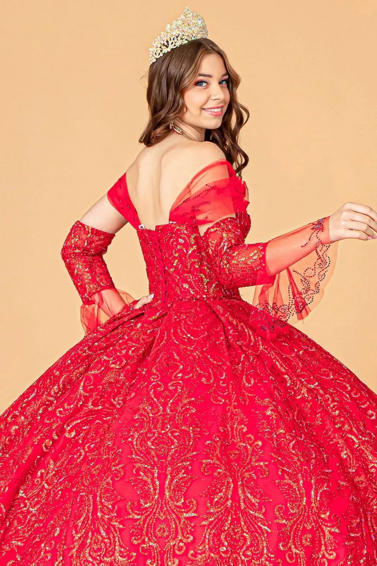 Embroidered details frame the Red quinceañera ball gown with detachable trumpet sleeves.
