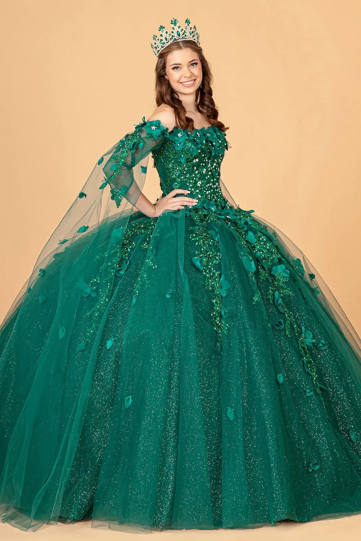 Embroidered details frame the Green quinceañera ball gown with shoulder mesh drapes.
