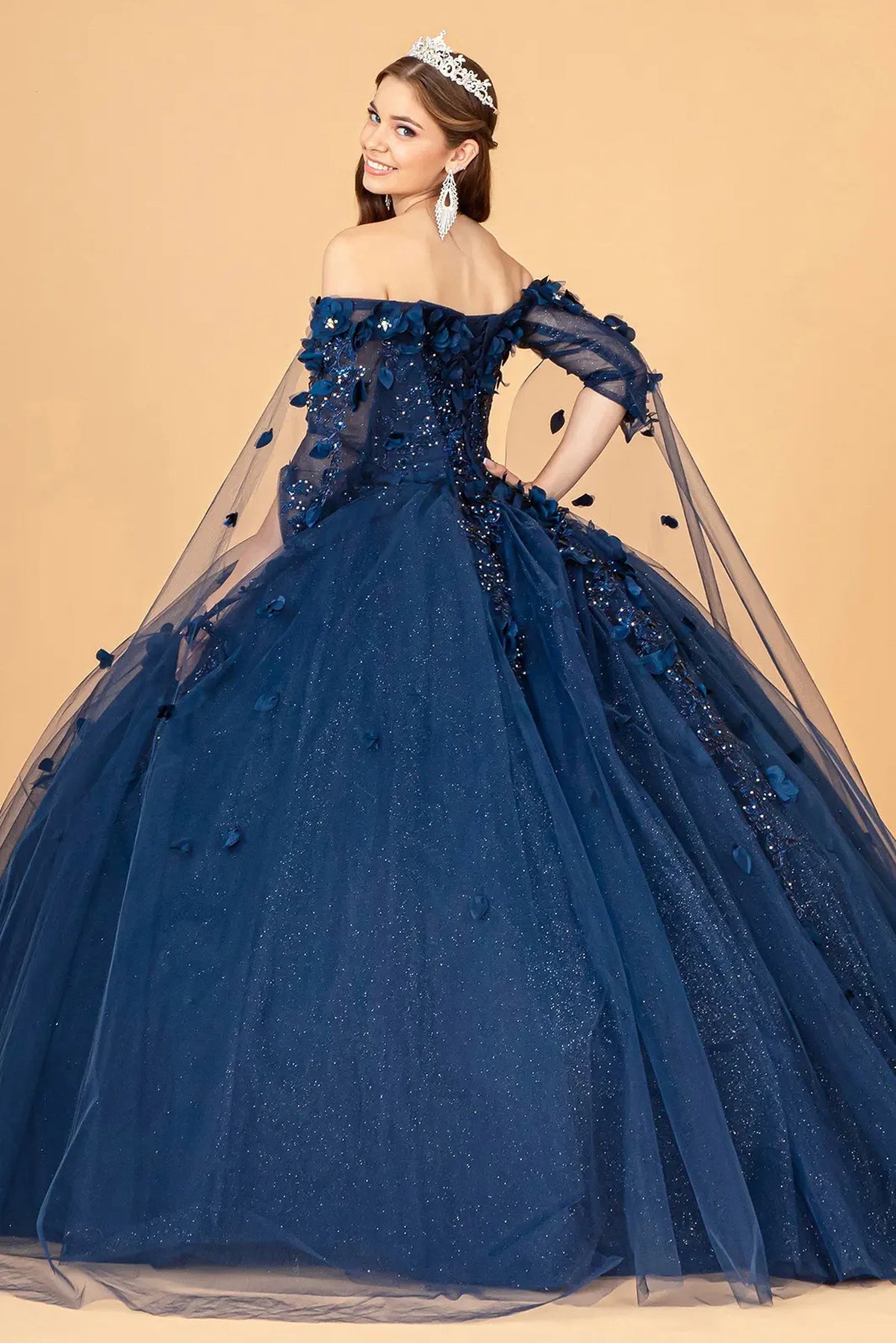 Bodice close-up highlights the Navy quinceañera ball gown with 3d floral appliqués.