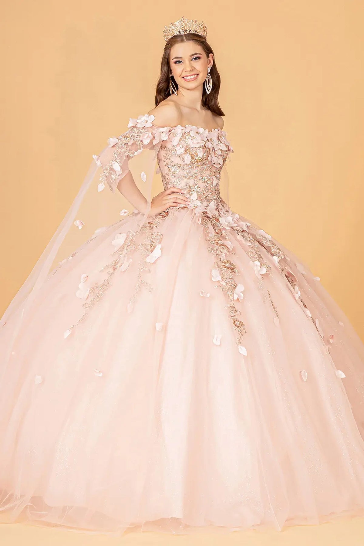 Embroidered details frame the Rose Gold quinceañera ball gown with shoulder mesh drapes.