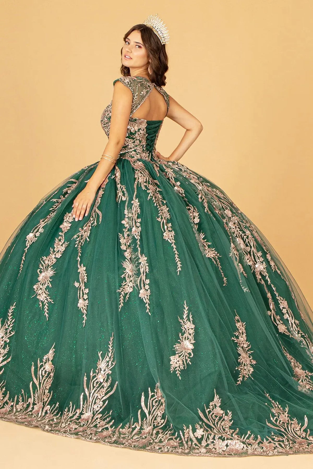 Bodice close-up highlights the Green quinceañera ball gown with airy mesh cape.