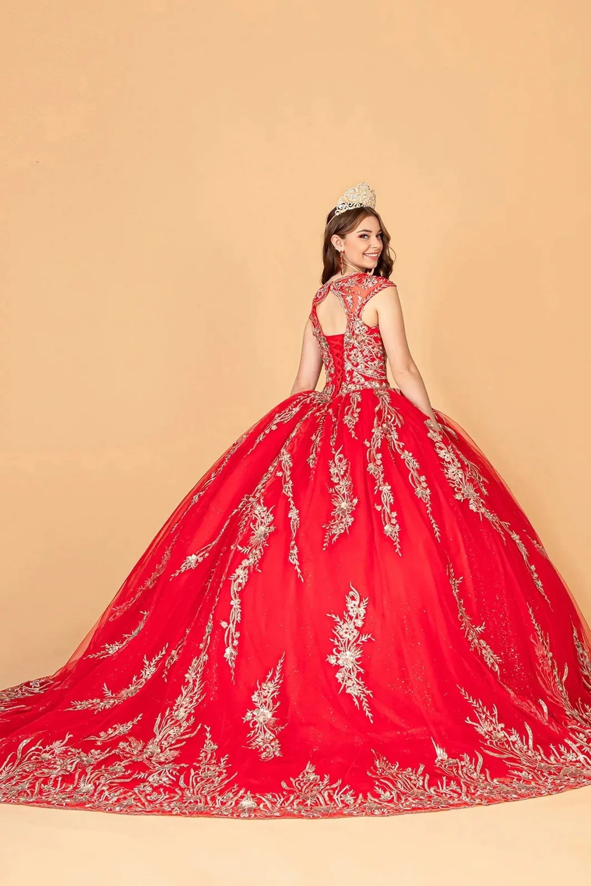 Bodice close-up highlights the Red quinceañera ball gown with airy mesh cape.