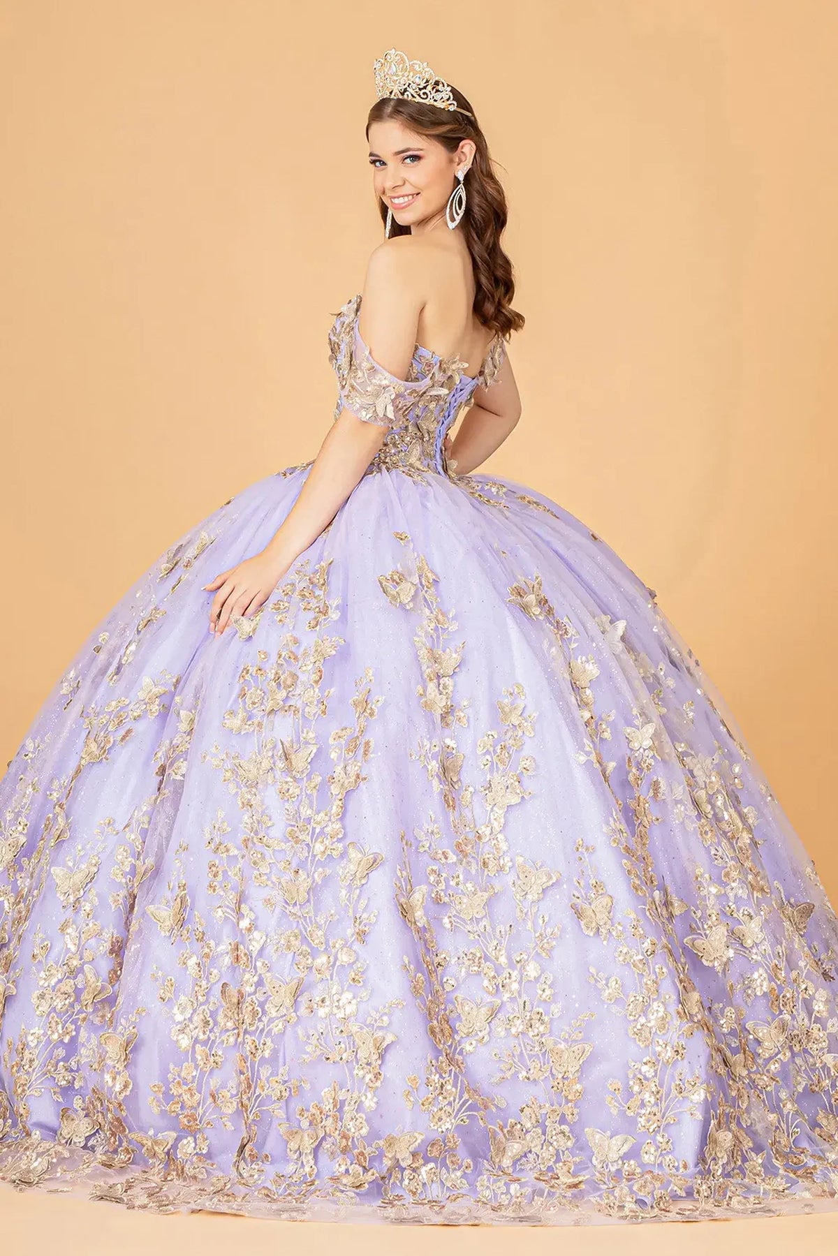 Bodice close-up highlights the Lilac quinceañera ball gown with gold metallic embroidery.