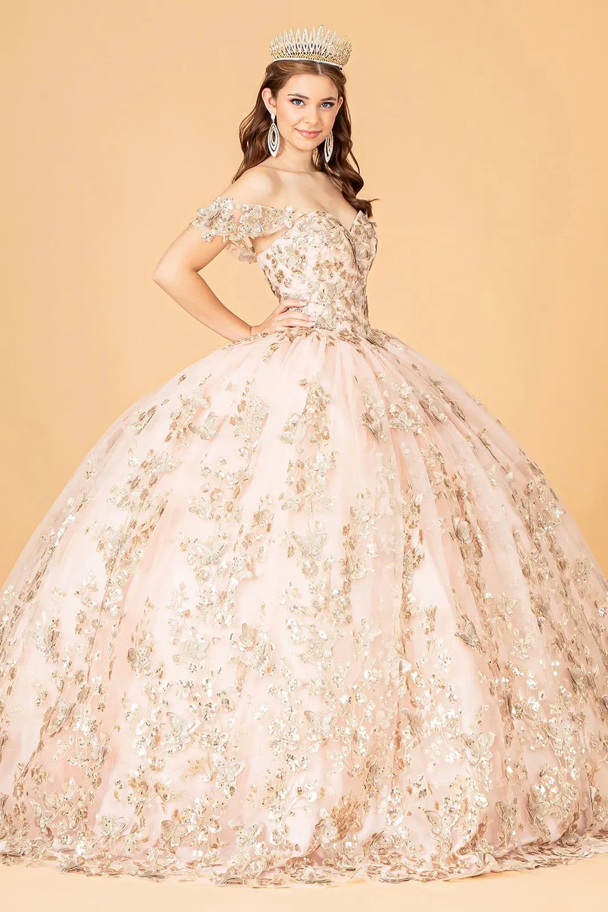 Embroidered details frame the Rose Gold quinceañera ball gown with 3d butterfly appliqués.