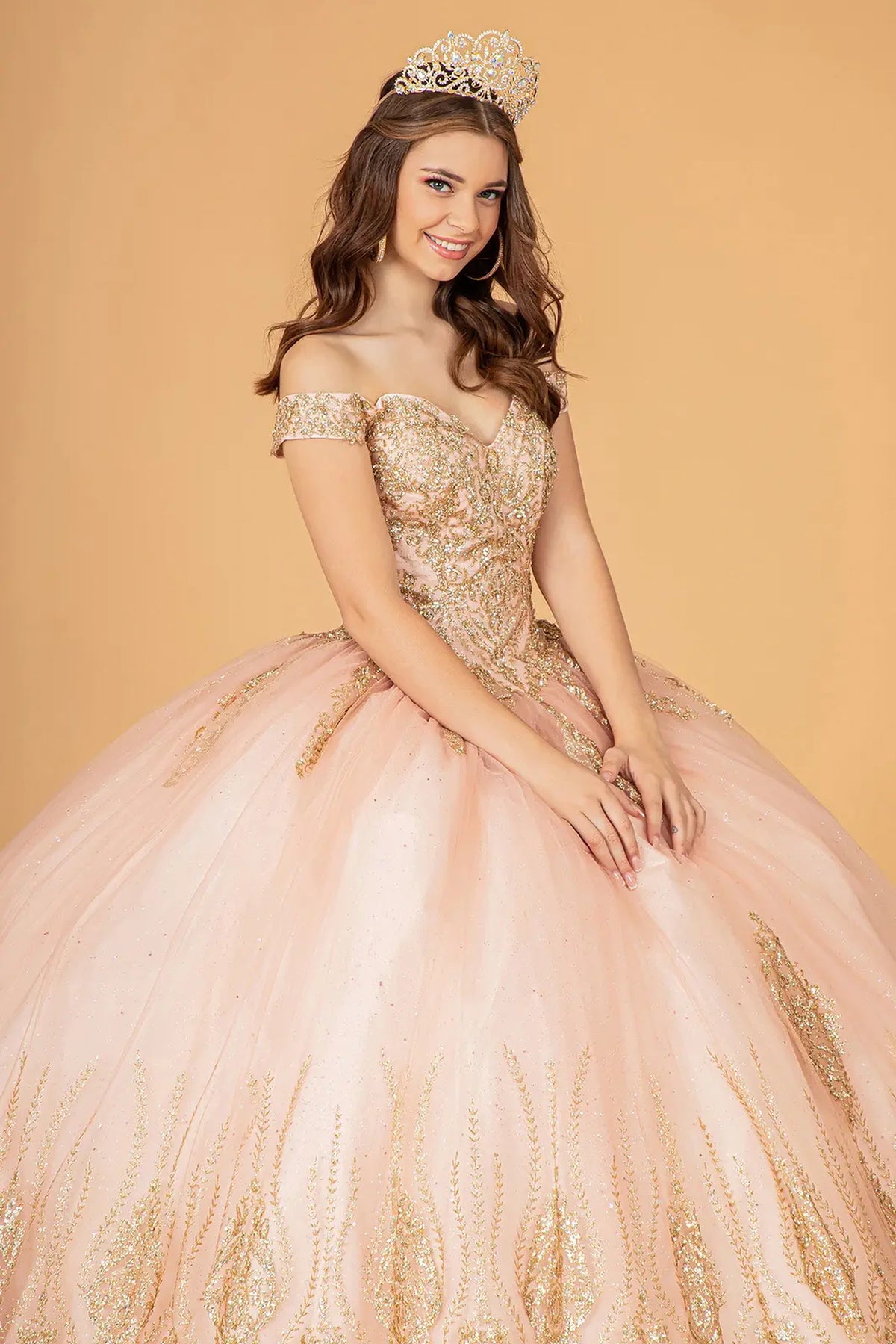 Full-length view presents the Rose Gold quinceañera ball gown with gold metallic embroidery.