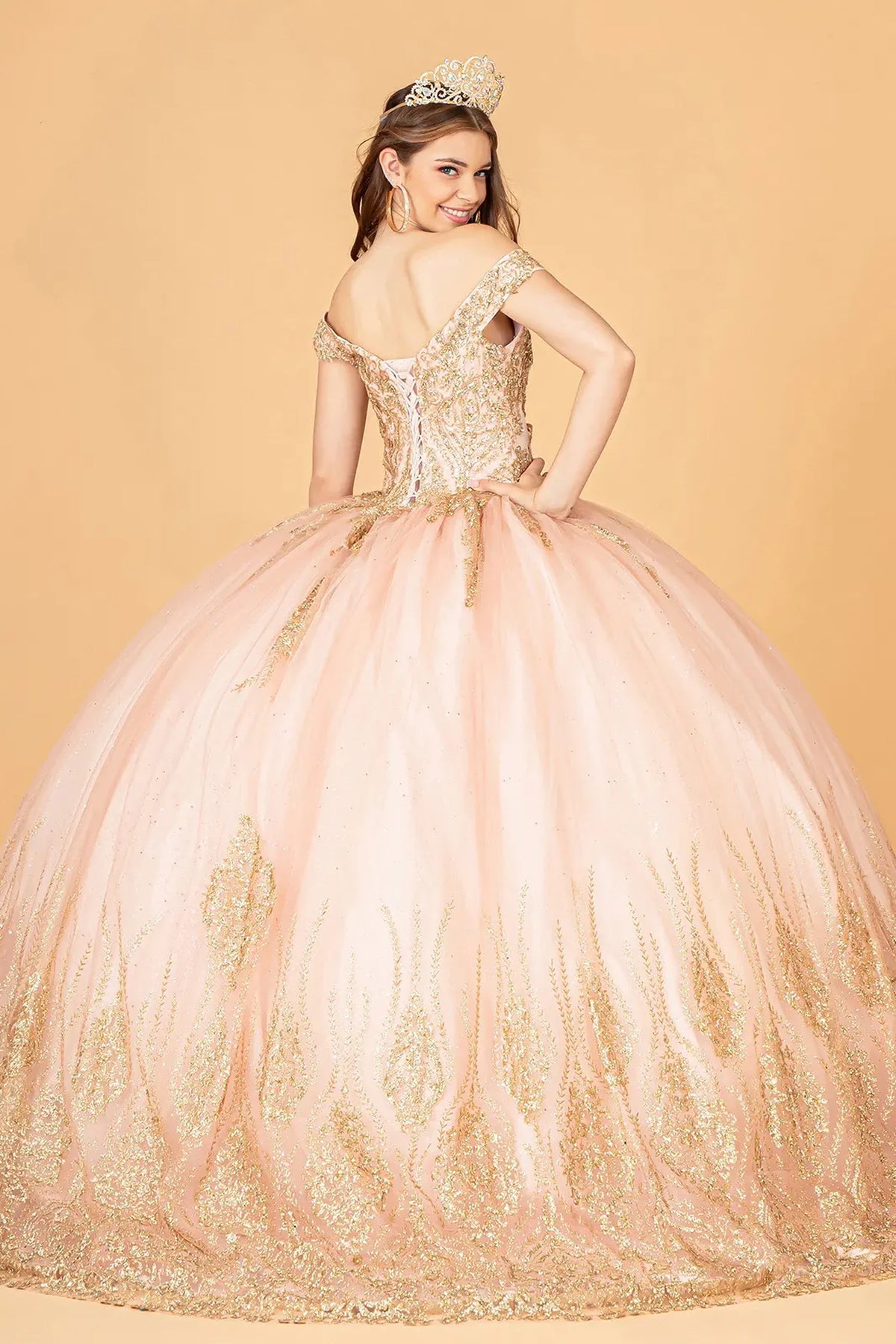 Bodice close-up highlights the Rose Gold quinceañera ball gown with glitter sequin mesh.