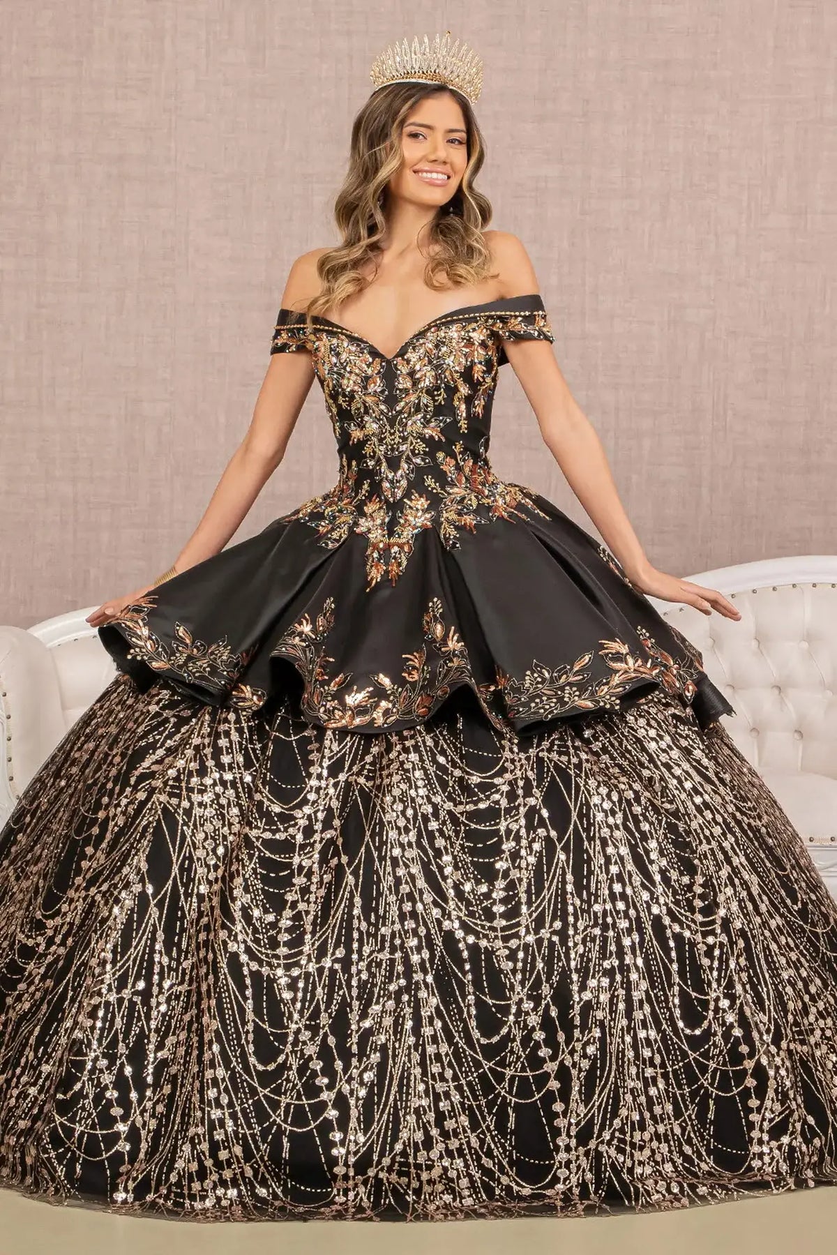 Lace-up back reveals the Black/Gold quinceañera ball gown with lace-up back and convertible high-low skirt.