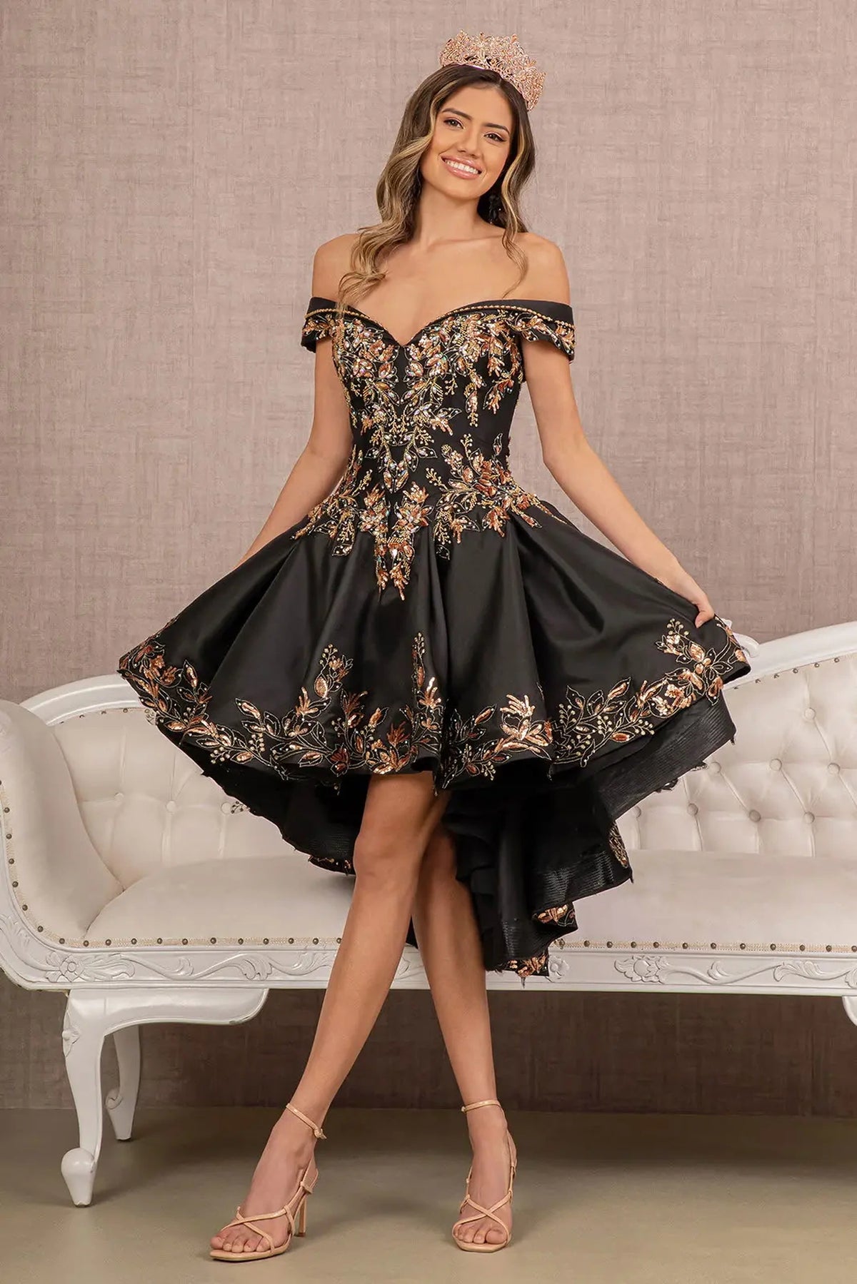 Embroidered details frame the Black/Gold quinceañera ball gown with gold embroidered train.