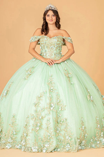 Woman wearing a sage floral off-shoulder gown with a tiara against a beige background