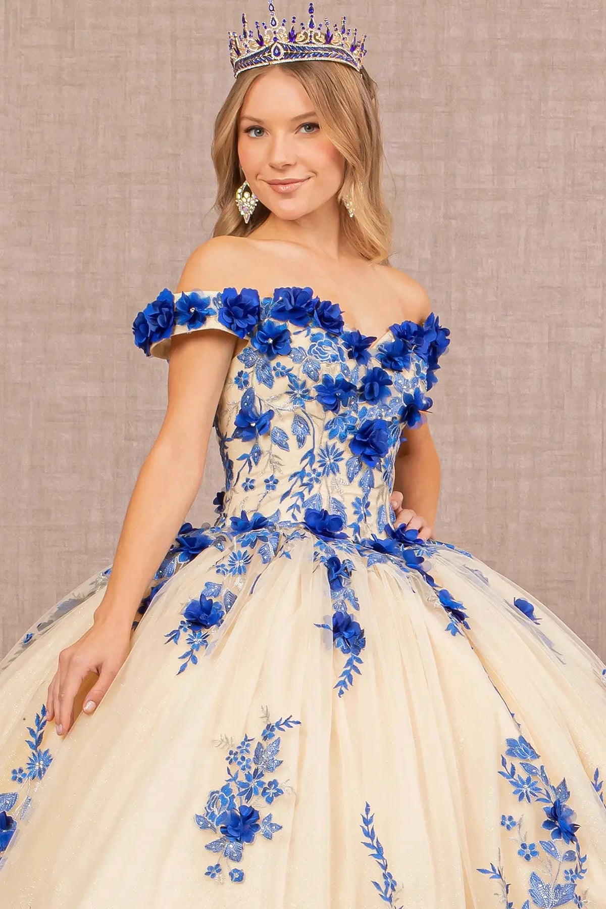 Full-length view presents the Royal Blue/Nude quinceañera ball gown with 3d floral embroidery.
