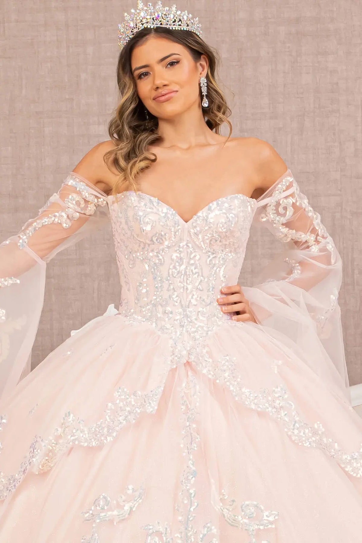 Full-length view presents the Blush quinceañera ball gown with layered hem.