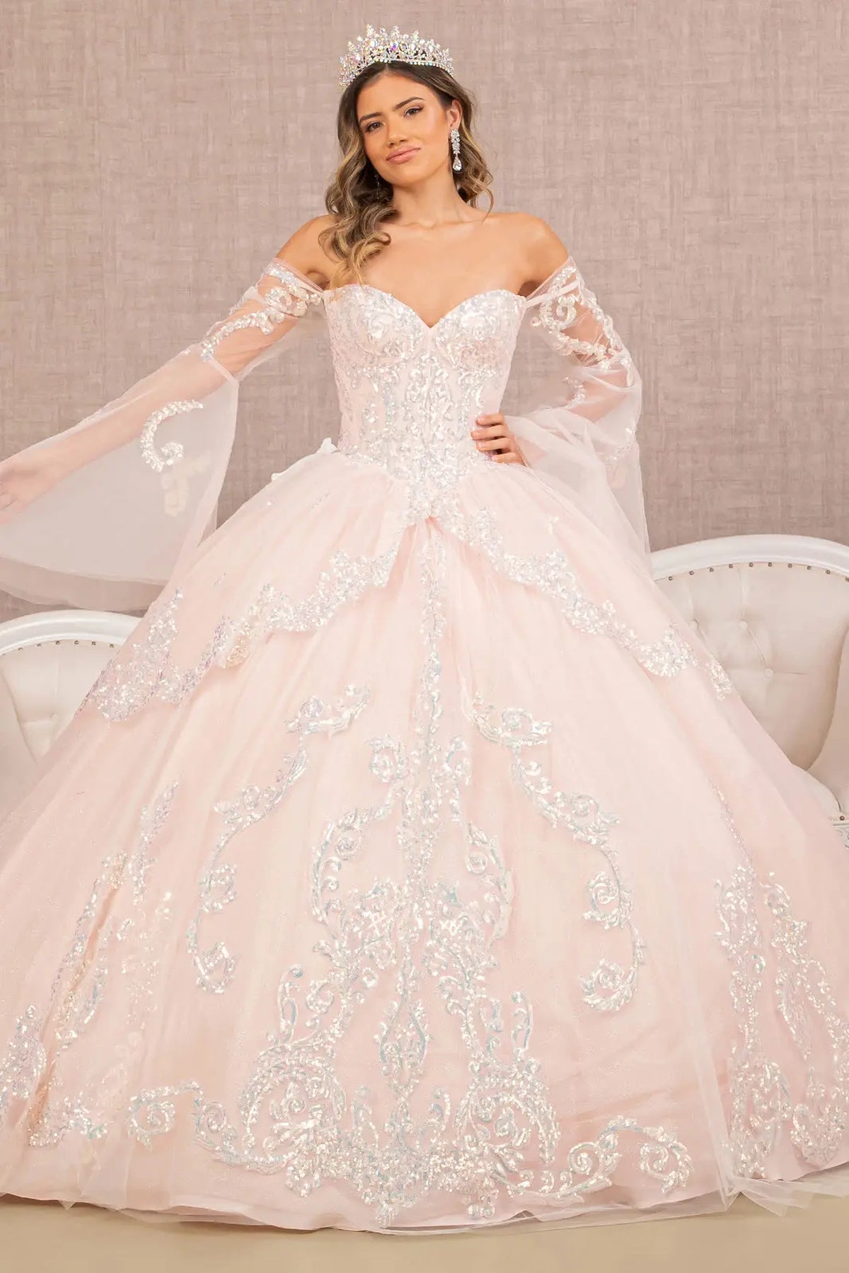 Lace-up back reveals the Blush quinceañera ball gown with lace-up back and long mesh sleeves.