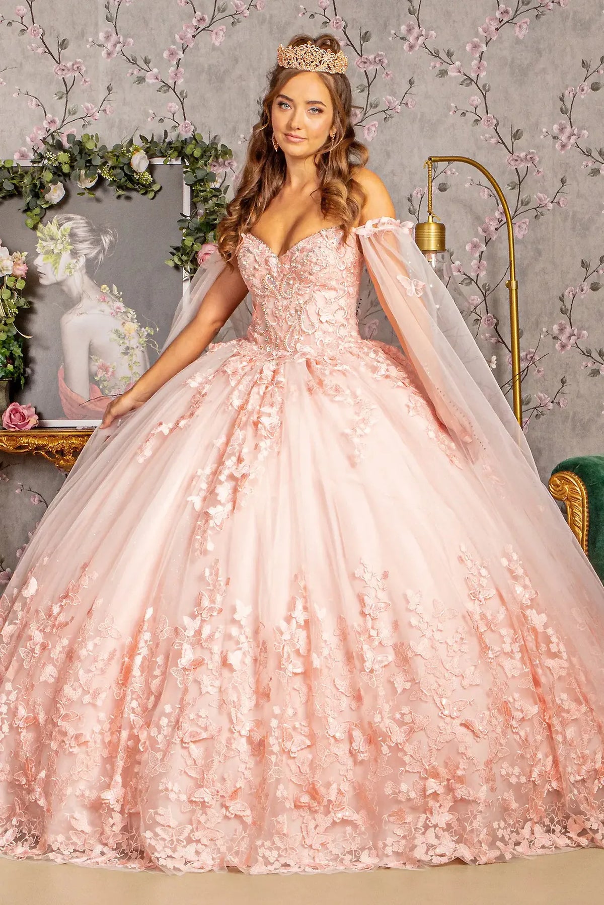 Lace-up back reveals the Blush quinceañera ball gown with lace-up back and long mesh drape.