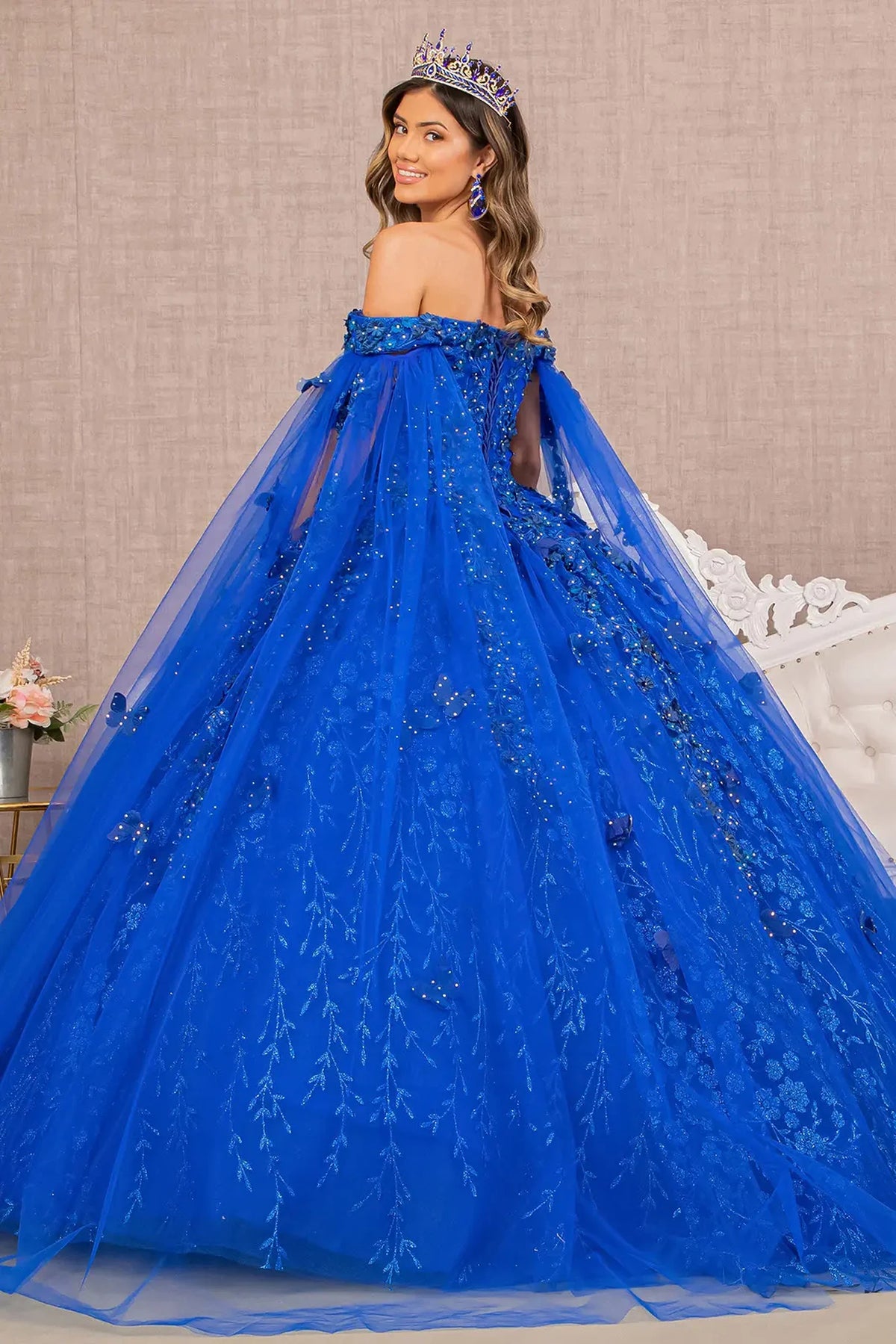 Bodice close-up highlights the Royal Blue quinceañera ball gown with glitter embroidery.