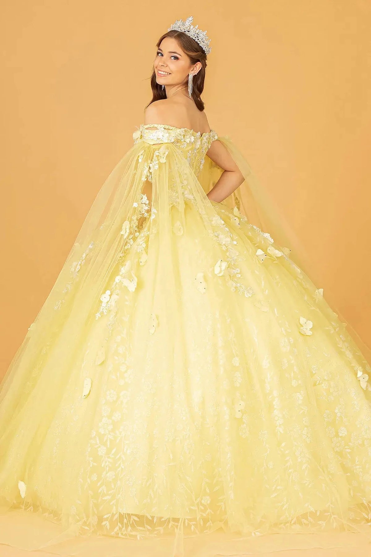 Bodice close-up highlights the Yellow quinceañera ball gown with glitter embroidery.