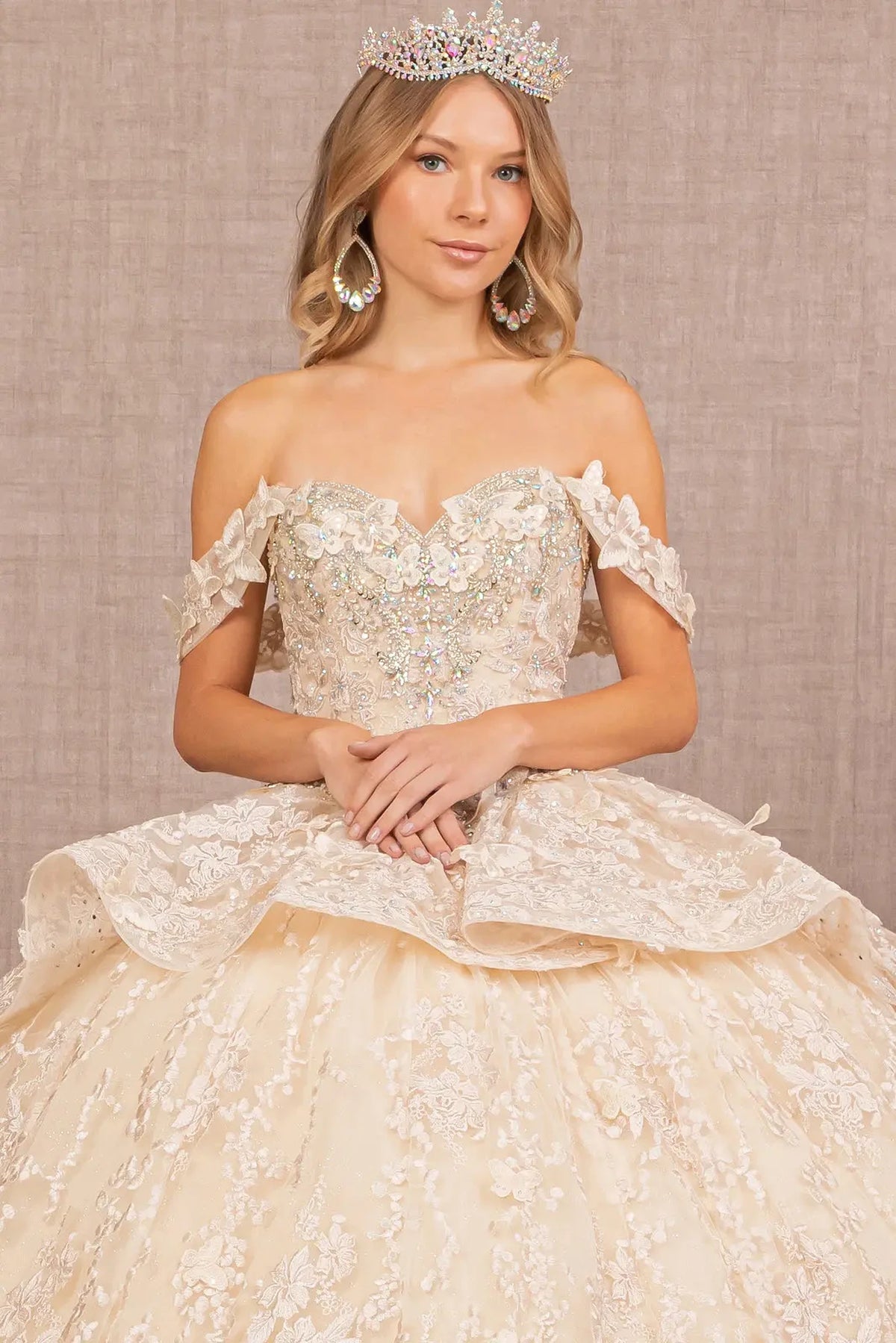 Full-length view presents the Champagne quinceañera ball gown with 3d butterfly appliqués.